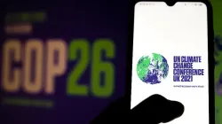 Le logo de la Conférence des Nations unies sur le changement climatique (COP26) de 2021 affiché sur un smartphone. Rafapress via Shutterstock. / 